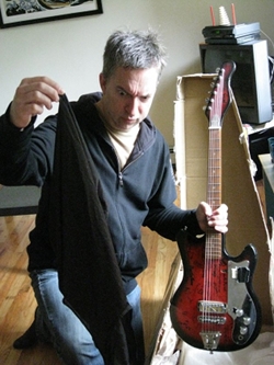 The $100 Guitar, Greg Anderson